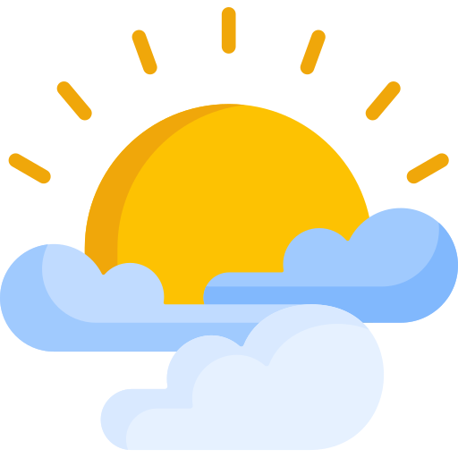 The sun shining with a couple of small clouds drifting across the sky